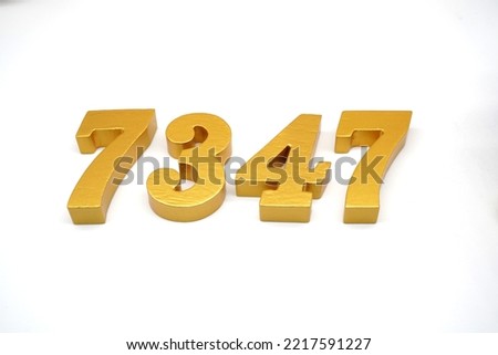   Number 7347 is made of gold-painted teak, 1 centimeter thick, placed on a white background to visualize it in 3D.                                   
