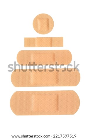 Set of different adhesive plasters or bandages isolated on white background.