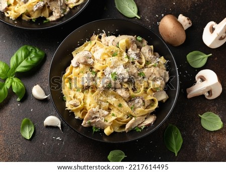 Creamy Alfredo pasta with chicken, mushrooms and parmesan cheese. Healthy Italian food Royalty-Free Stock Photo #2217614495