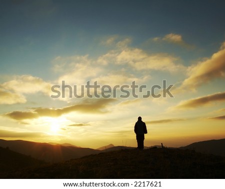 Girl silhouette on the sunset background