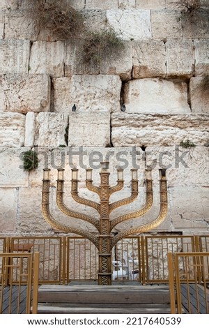 The official Hanukkah menorah of the Western Wall in Jerusalem, alight with all eight candles burning on the final night of the eight-day festival. 