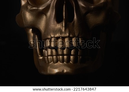 Gold human Skull Isolated on black