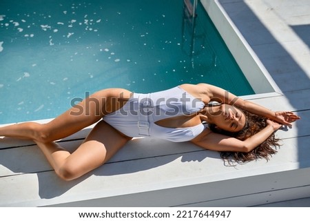 Woman enjoying summer relax at swimming pool