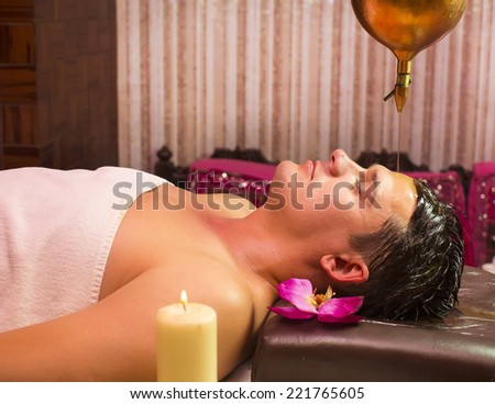 man engaged in Ayurvedic spa treatment