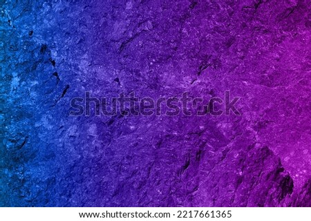 Blue and pink light colored rock texture background. Copy space for text. multicolored stone