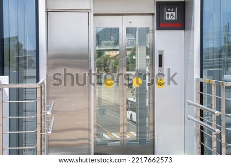 View of the street vertical elevator for people with disabilities installed at the entrance to the building. The concept of an accessible environment for people with disabilities