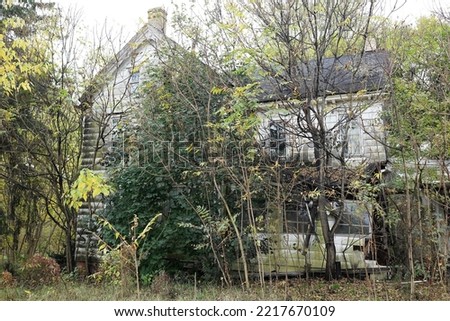 old abandon far house in the woods Royalty-Free Stock Photo #2217670109