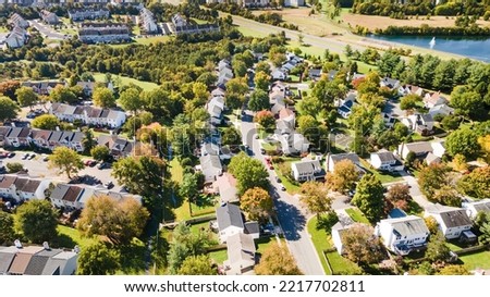Aerial view of upscale residential area, gated community street real estate with single family homes. Autumn sunny day. Royalty-Free Stock Photo #2217702811