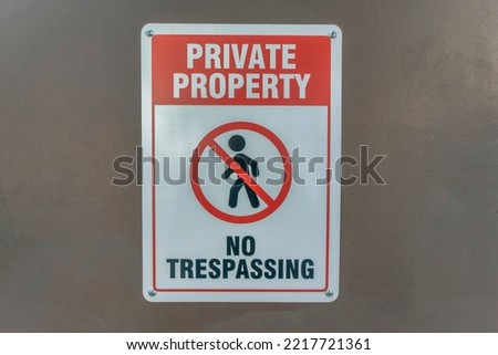 Private Property No Trespassing sign at a restricted property in Austin Texas. Close up view of a signage prohibiting unauthorized persons to enter an nonpublic building or area.