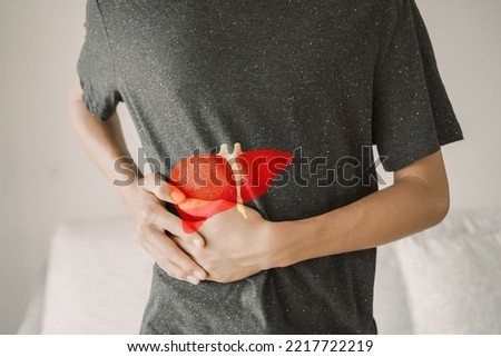 Man with liver pain, hepatitis vaccination, liver cancer treatment, world hepatitis day Royalty-Free Stock Photo #2217722219