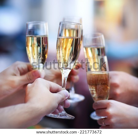 Celebration. People holding glasses of champagne making a toast