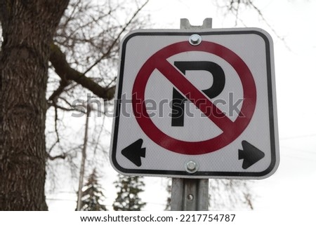 no parking sign near tree