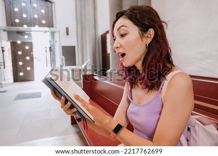 Woman singing and reading Gospel Songbooks in church. Leisure and religious education Royalty-Free Stock Photo #2217762699