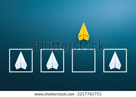 Business for solution concept with yellow paper planes on blue background. think outside the box, different thinking