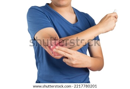 man apply painkillers to elbow , elbow muscle pain from inflammation on white background