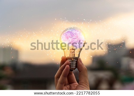 Businessman holding Light bulbs with Brain inside and Low poly wireframe outside. Creative and innovation inspiration. Business Bright idea concept. future technology, multiexposure.