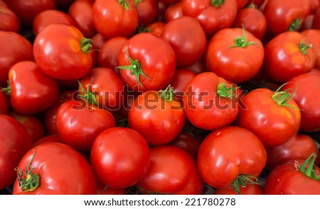 red tomatoes background. Group of tomatoes Royalty-Free Stock Photo #221780278