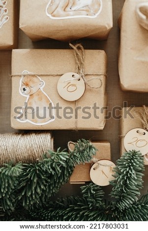 Christmas Advent calendar for kids. Gifts boxes with numbers and animal illustration for children. Eco friendly christmas