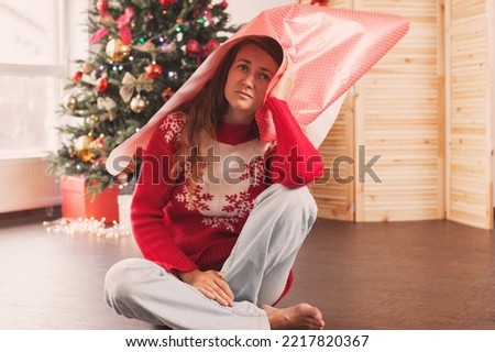 Woman feeling alone during christmas holiday. Upset female have problem of choosing Christmas gifts
