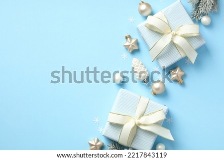 Christmas gifts and decorations on pastel blue background. Xmas card, New Year banner design.