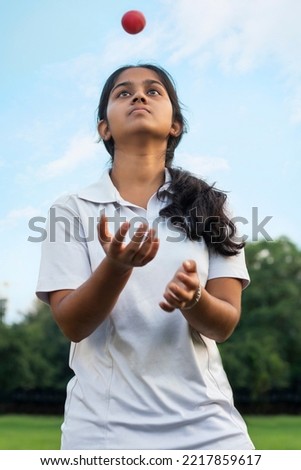 Indian Female cricket players practice in the ground with ball Royalty-Free Stock Photo #2217859617