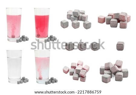 Set of glasses with water and soluble tablets on white background