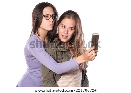 Two Girls Making a selfie on white isolated background