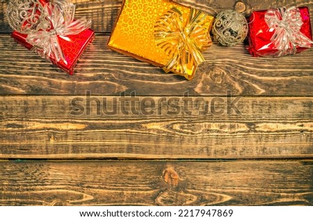 Christmas background with gifts on a wooden background with a place to copy.