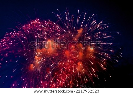 Fireworks with sparks, colored stars and bright nebula on black night sky universe, comets. Festive concept. Amazing holiday colorful firework display on celebration, showing. Copy text space