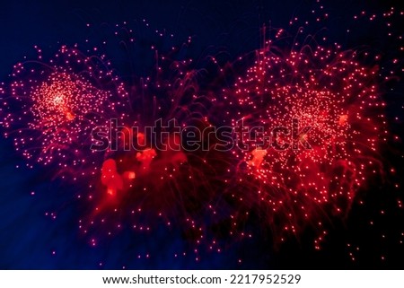 Amazing beauty colorful fireworks display on celebration, showing. Festive holiday firework with sparks, colored stars and bright nebula on black night sky universe, comets. Copy text space