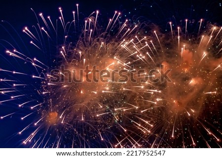 Full frame bright firework with sparks, colored stars and nebula on black night sky, comets. Festive wallpaper concept. Amazing holiday colorful fireworks display on celebration, showing. Copy space