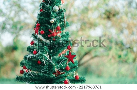 Christmas tree background and Decorated Christmas tree on blurred background.