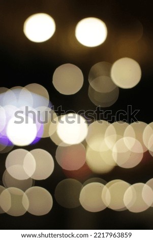 abstract background of colorful blurred defocused bokeh street lights. motion and nightlife concept.