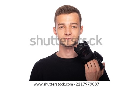 Young man with a DSLR camera on a white background.