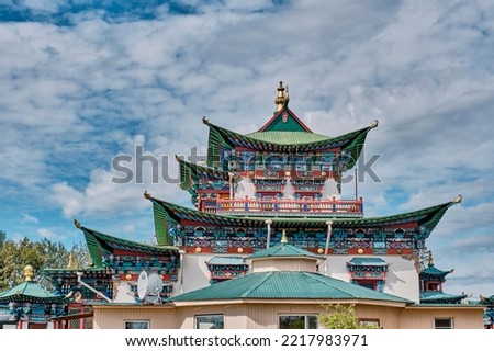 Roofs and upper floors of temple-palace of Hambo Lama Itigelov. Ivolginsky datsan, Buddhist monastic complex, Republic of Buryatia, Russia. Copy space Royalty-Free Stock Photo #2217983971