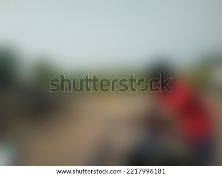 Sad and unhappy life of indian construction labor. Blurred image.