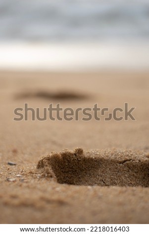 A picture of a footprints on the sand, symbolizing the memories the you leave behind in the journey of life