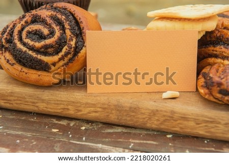 Cinnamon bun and other dough with empty business card template