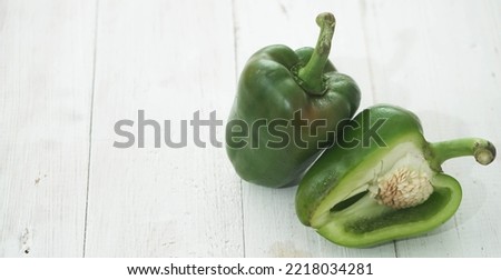 Organic Green bell pepper isolated on white background in selective focus