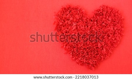 Red heart romantic background with decorative crepe paper love symbol. Low contrast banner design with copy space for Valentines day.