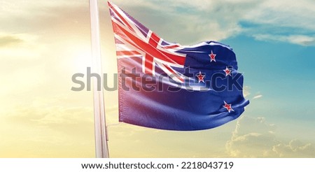 New Zealand national flag waving in beautiful clouds.