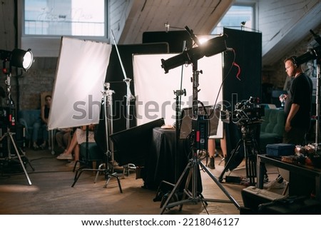 Film set, monitors and modern shooting equipment. Film crew, lighting devices, monitors, playbacks - filming equipment and a team of specialists in filming movies, advertising and TV series