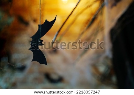 Background for halloween. Bat made of black paper.