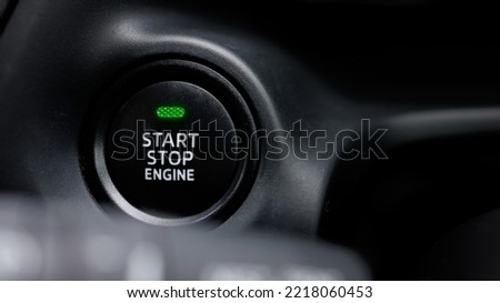 The engine start and stop button for modern car engine ignition. Keyless technology concept. Royalty-Free Stock Photo #2218060453
