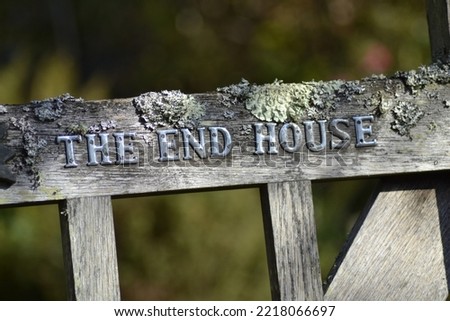 Old wooden gate with the inscription The End House
