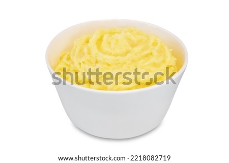 Mushed potato in a bowl on a white isolated background. toning Royalty-Free Stock Photo #2218082719