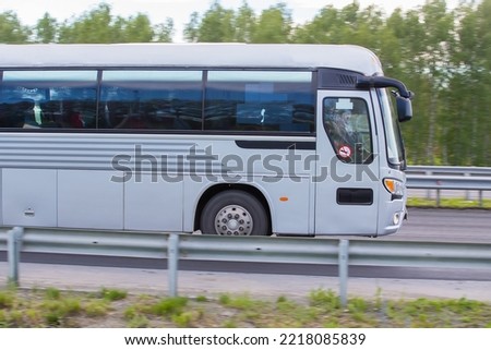 tourist bus goes on asphalted country  highway