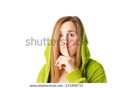 girl making silence gesture over isolated white background 