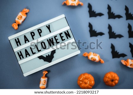 Happy Halloween Sign with decoration on blue background