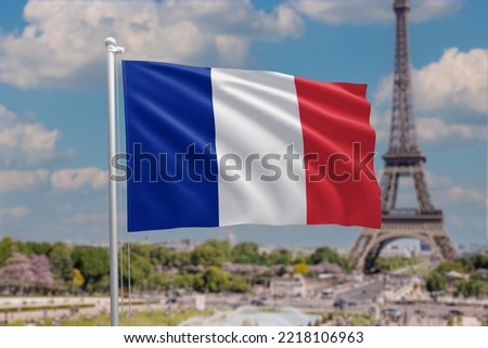 Flag of France waving in the wind. French flag on sunny blue sky background on a white flag pole